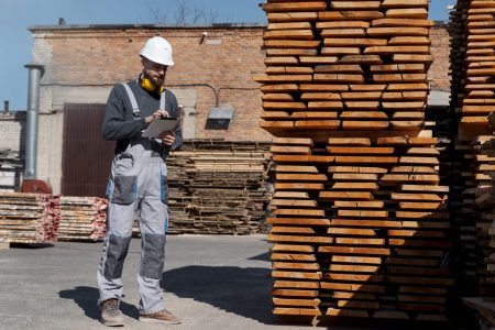 man-working-mdf-boards-warehouse-scaled-2000x1334
